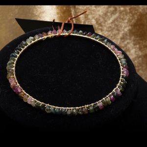 The colors IG Tourmaline bangle. Gold alloy wire wrapped bracelet with real gems